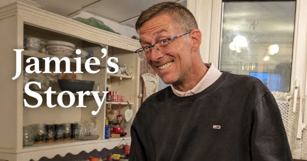 Smiling man wearing glasses beside the text Jamie’s Story