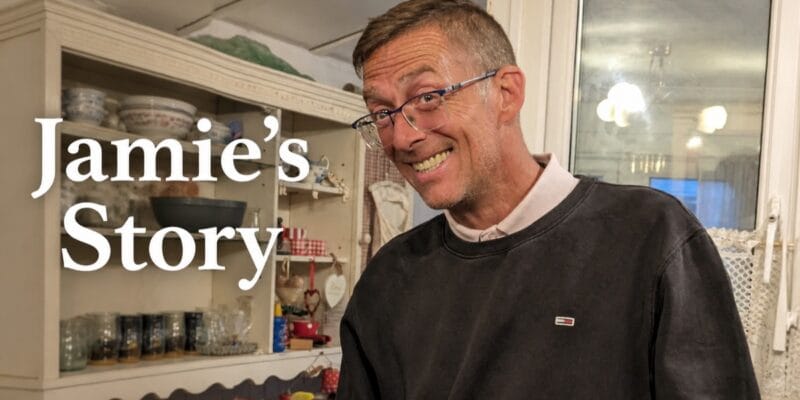 Smiling man wearing glasses beside the text Jamie’s Story