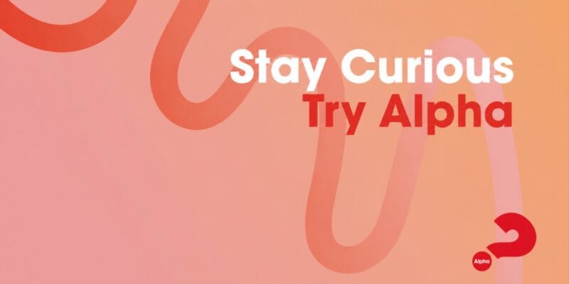 Text reading “Stay Curious Try Alpha” with a red question mark on a pink-orange background