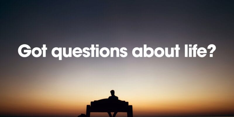 Silhouette of a person sitting on a bench at sunset beneath the text “Got questions about life?”