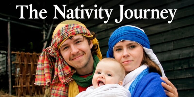 The Nativity Journey: two adults in head coverings with a baby wrapped in white cloth