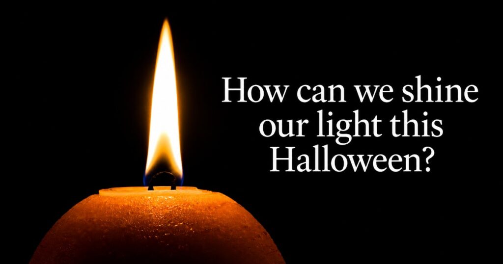 Lit orange candle beside text reading “How can we shine our light this Halloween?”